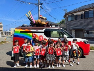 世界に1台しかないワゴン」、笑顔を届ける「グリコワゴン活動」とは